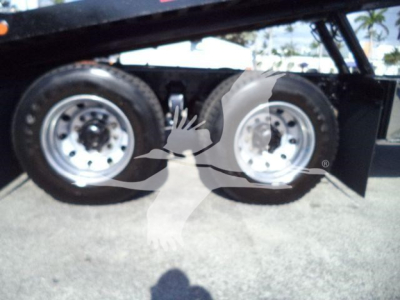 Freightliner M2 106 rollback truck wheel wells and dual rear tires visible underbed with metal fender.