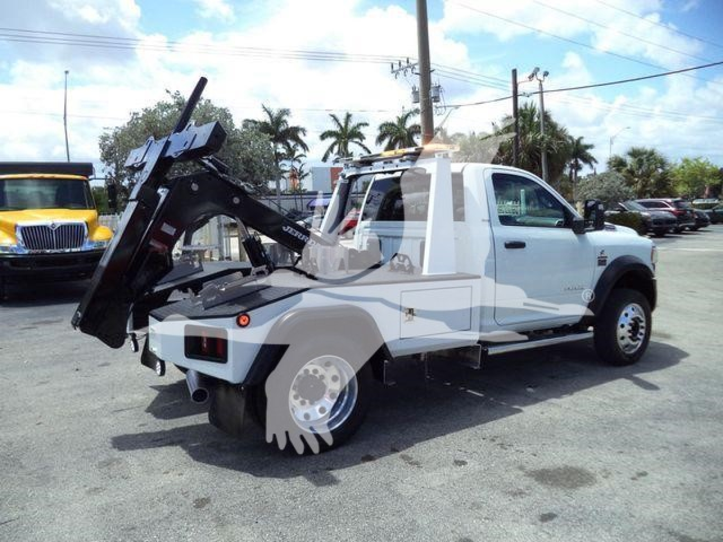 Ram 4500 tow truck with mounted winch and equipment viewed from rear-left side.