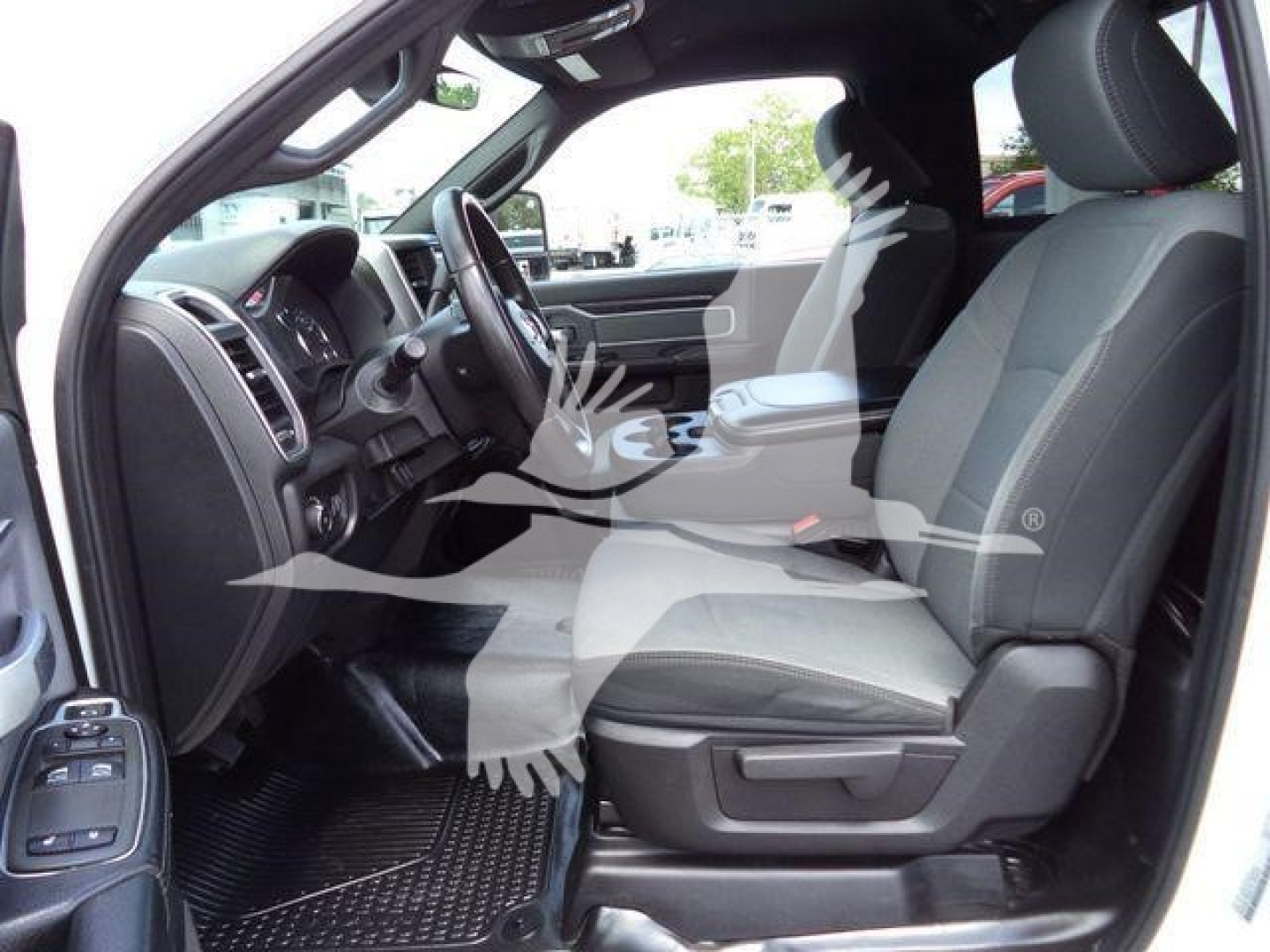Ram 4500 SLT interior front seats and dashboard view from driver side, showing black and gray cloth seats and steering wheel.
