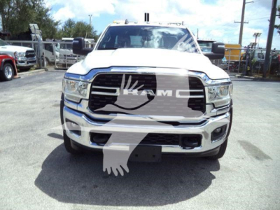 Ram 4500 front view showing chrome grille with RAM emblem and headlights, white cab, winch category vehicle, stock number is visible but text not legible