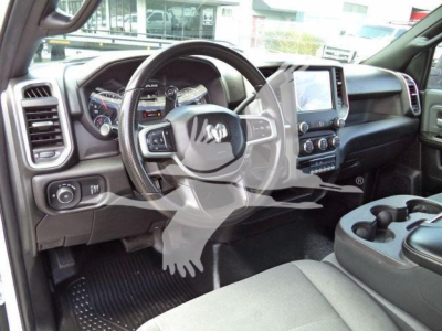 Ram 4500 interior showing steering wheel, dashboard, center console with touchscreen, and cup holders.