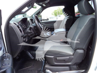 Ram 4500 SLT interior front seats and dashboard view from driver side, showing black and gray cloth seats and steering wheel.
