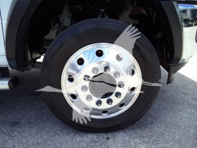 Wheel close-up on Ram 4500 SLT showing front tire and polished steel rim with multiple lug nut holes.