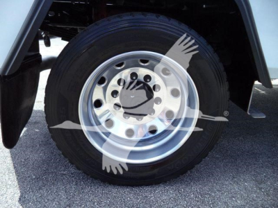 Wheel and tire on Ram 4500 truck showing steel wheel with multiple holes and hub, part of wheel well and fender; no readable labels visible in image.