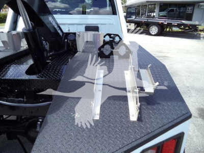 Ram 4500 Soo winch mounting platform with metal brackets and controls visible on diamond plate surface.