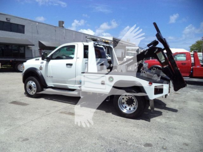 Ram 4500 tow/winch truck in-service view showing front cab and rear bed with mounted winch and equipment