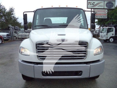 Front view of a white 2020 Freightliner M2 106 rollback truck showing large grille, headlights, bumper, and Freightliner emblem on hood.