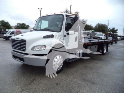 Truck image showing a white 2020 Freightliner M2 106 rollback wrecker chassis with flatbed and hydraulic system, front grille, headlights, and side mirrors.