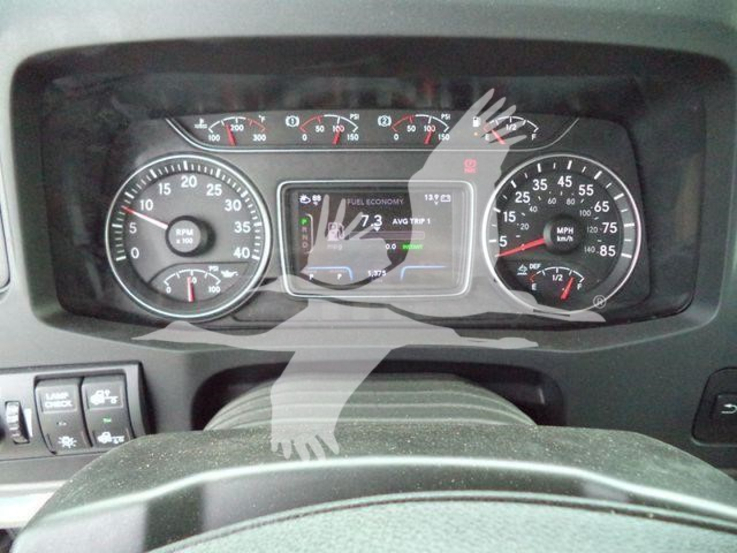 Dashboard of a new 2026 International MV rollback truck showing speedometer gauges and central digital display.