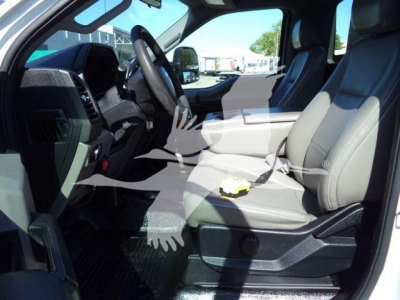 Interior view of a 2019 Ford F550 cab showing front seats, steering wheel, and dashboard.