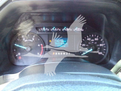 Ford F-550 instrument cluster with RPM gauge, speedometer, and digital display showing PRNDM21 gear indicator.