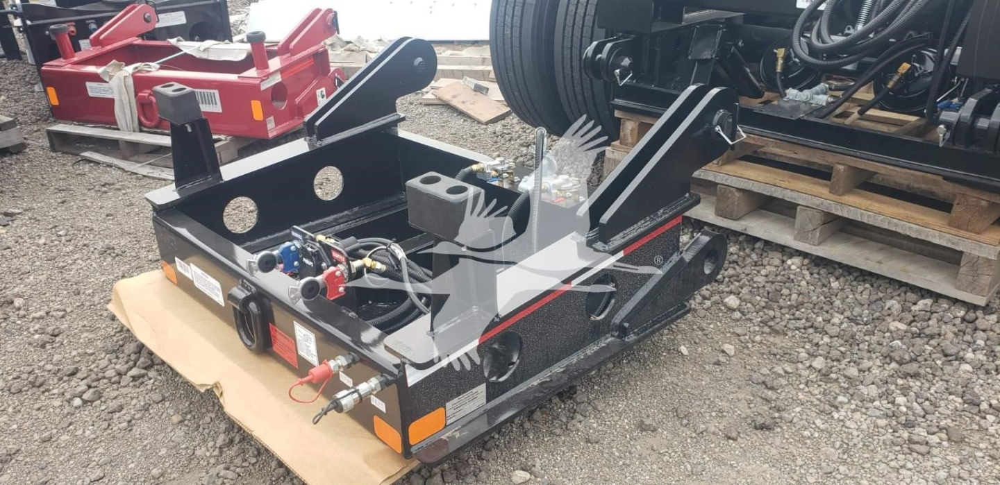 Fontaine flip box trailer front view showing hydraulic controls, hoses, and mounting brackets with towing kingpin and reflectors.