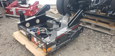 Fontaine flip box trailer front view showing hydraulic controls, hoses, and mounting brackets with towing kingpin and reflectors.
