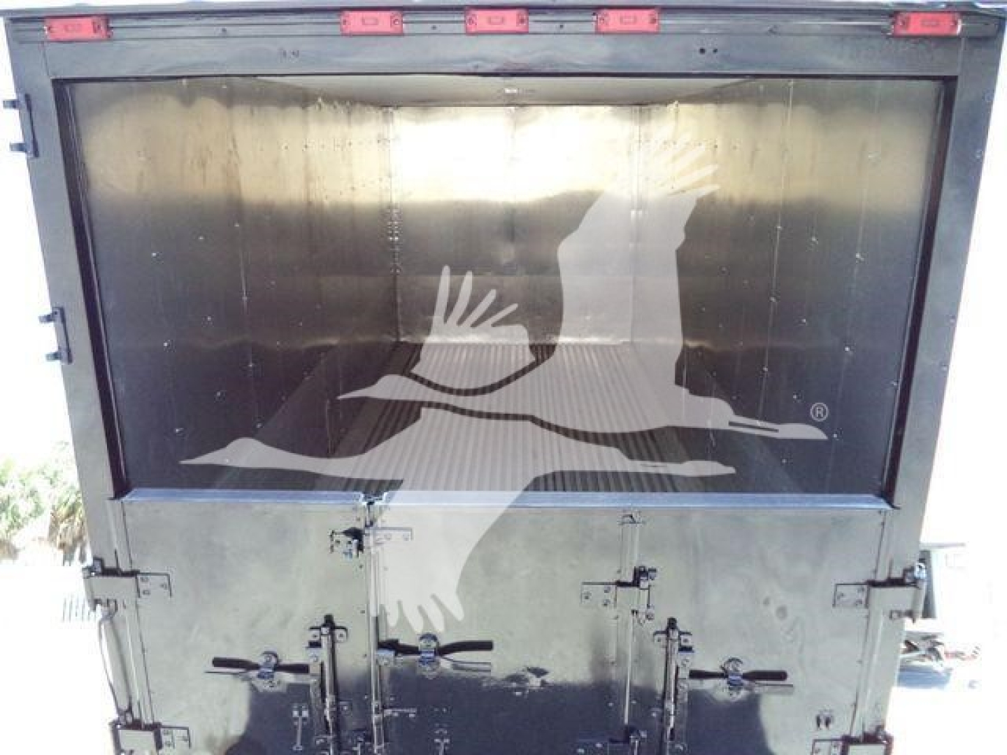 Truck bed rear view of 2019 International Durastar 4300 with chipper category, stock number T82499FM; back doors closed.