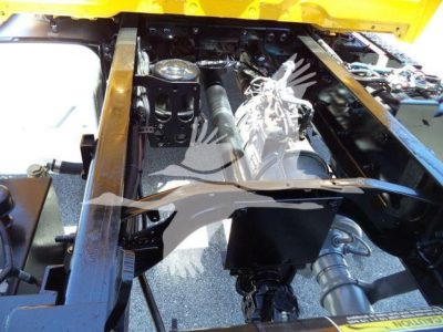 Chassis view of a 2019 International Durastar 4300 truck showing engine bay components and frame rails.