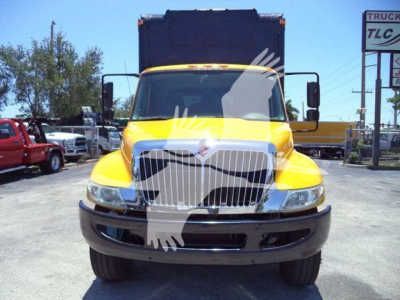 Truck front view of a yellow 2019 International Durastar 4300 with chrome grille, black bumper, and dual side mirrors.