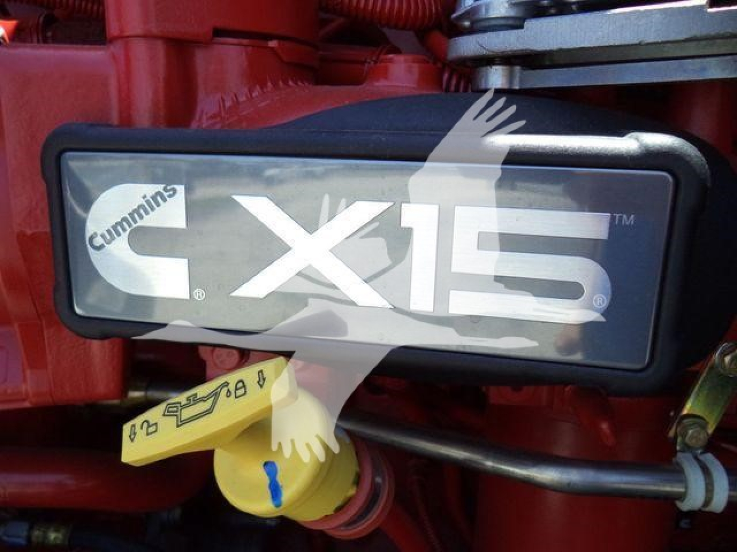 Kenworth T880 engine bay with Cummins X15 badge and fuel cap visible.
