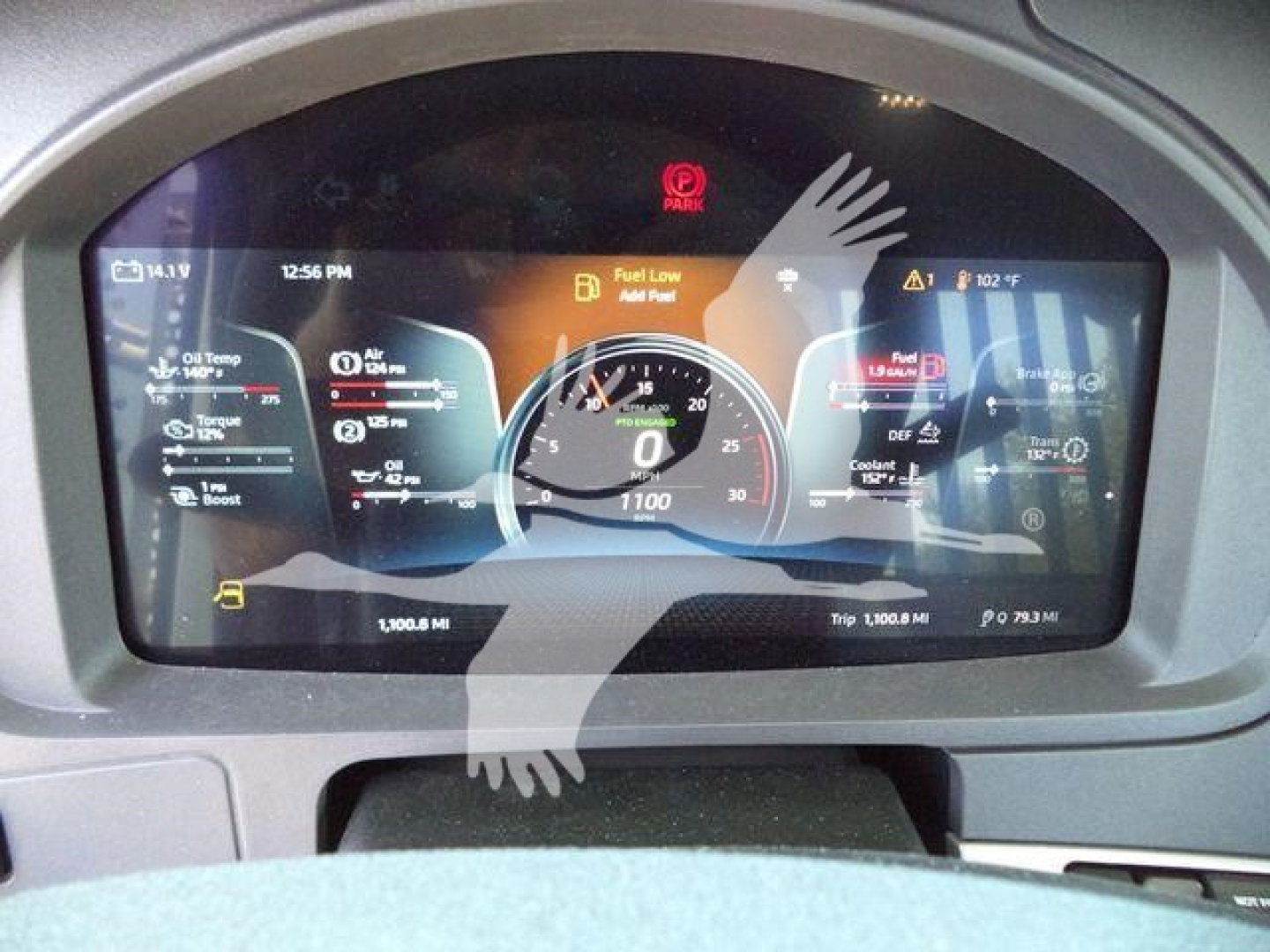 Dashboard display of a 2026 Kenworth T880 showing digital gauges, warning icons, and trip data.