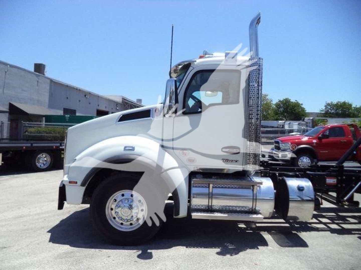 Kenworth T880 cab facing left with chrome fuel tank and steps, side view, no license plate visible.