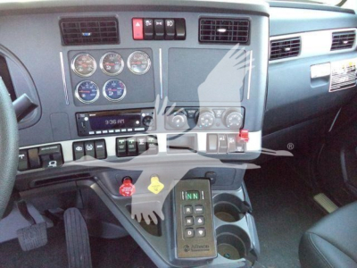 Kenworth T880 truck interior dashboard showing gauges and gear selector panel.