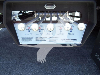 Kenworth T880 rollback truck control panel with eight levers and instruction panel labeled Jerr-Dan Tow/Brake/Spill controls.