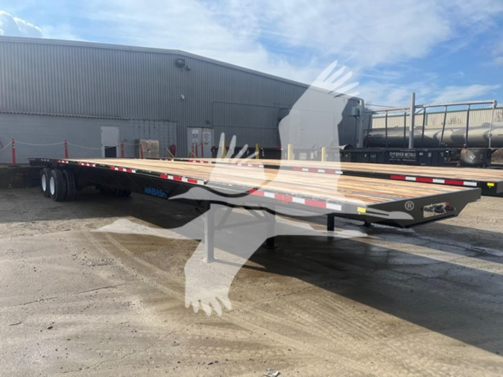 Flatbed trailer with steel slider deck showing low-profile frame and dual rear axles.