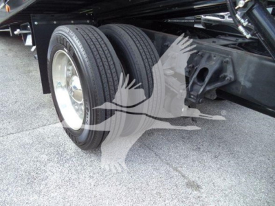 Peterbilt 337 chassis with dual rear wheels and suspension components visible; focus on wheel, tire, and frame.