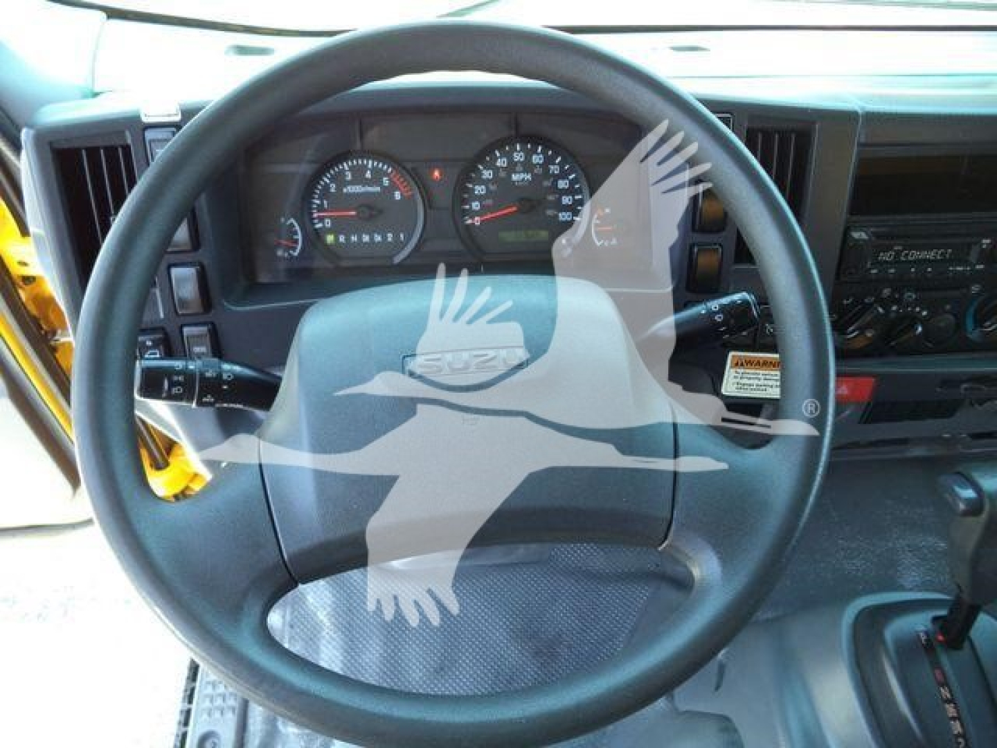 Dashboard and steering wheel of a 2023 International CV truck cab showing instrument cluster and controls.