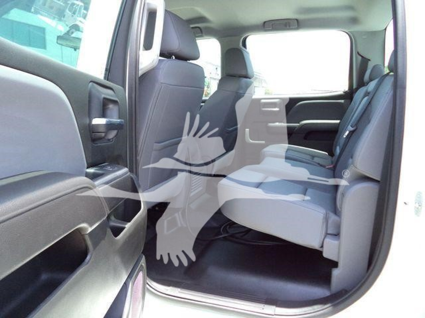 Interior of a new 2023 International CV pickup truck showing back seats and rear passenger area.