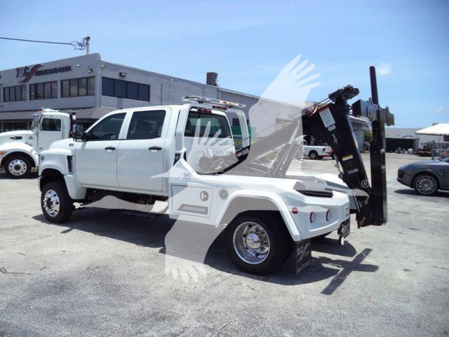 2023 International CV trucks towing winch setup with white cab and black mounted equipment in a dealership lot