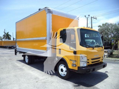 Isuzu NPR HD box truck in-service showing yellow cab and large amber cargo box, front-right view with stock number tag in background.