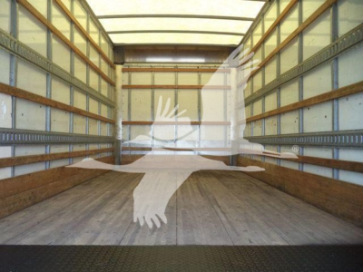Isuzu NPR-HD box truck interior with empty cargo area and wooden floor, view from rear; stock number not visible.