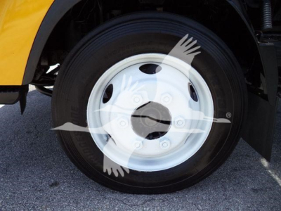 Isuzu NPR-HD truck wheel and tire with white steel rim.