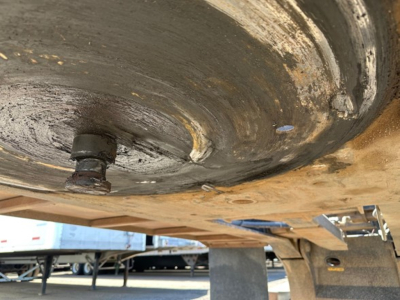 Underbelly view of a 2008 Trail King 50 Ton lowboy trailer showing a pony motor access plate and underside structure.