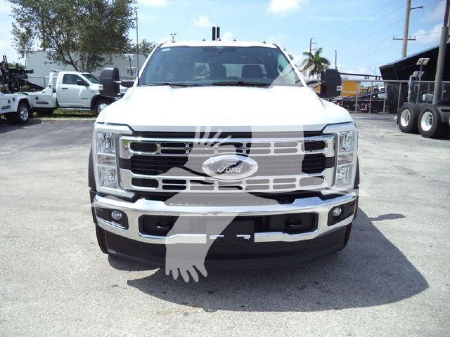 Front view of a white 2024 Ford F-450 truck in a dealership lot, stock number J40065FM, category Winch, new.