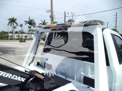 Ford F-450 winch truck cab rear view showing light bar and winch equipment