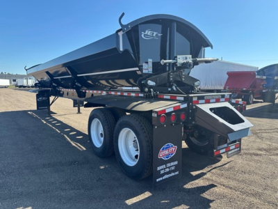 Dump trailer showing Jet welded steel pivot points, dual rear axles, and tub flex corners with rear strobe and safety lights.