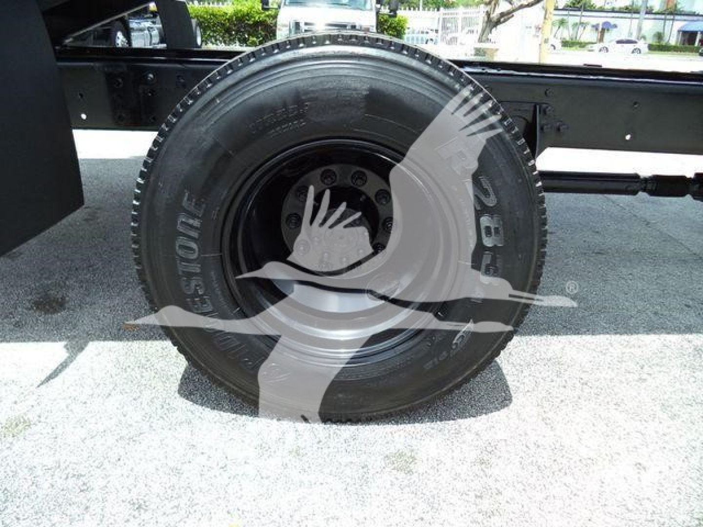 Tire close-up on a 2019 International 4300 grapple truck showing Bridgestone tire and wheel assembly.