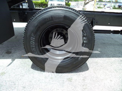 Tire close-up on a 2019 International 4300 grapple truck showing Bridgestone tire and wheel assembly.