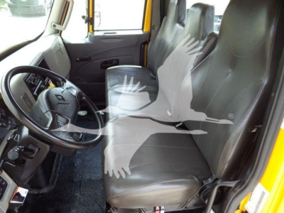 Interior of a 2019 International 4300 cab showing steering wheel, driver seat, and passenger seats with gray upholstery.