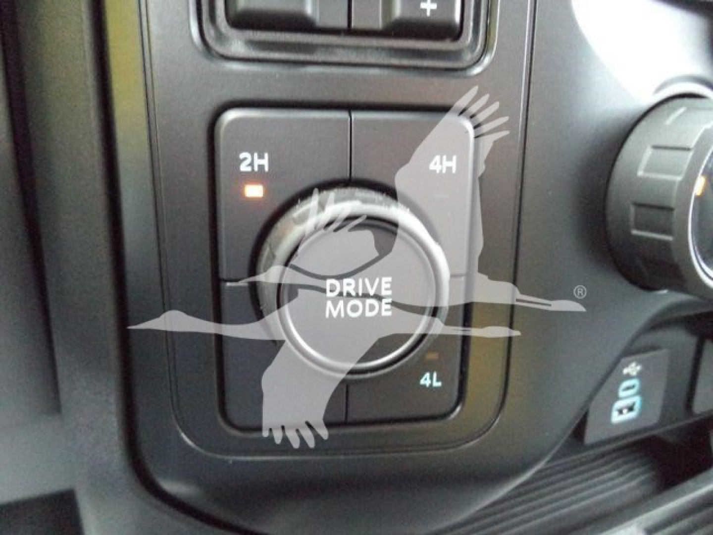 Ford F-450 drive mode selector with 2H 4H 4L on center dial and 2H/4H indicators visible.