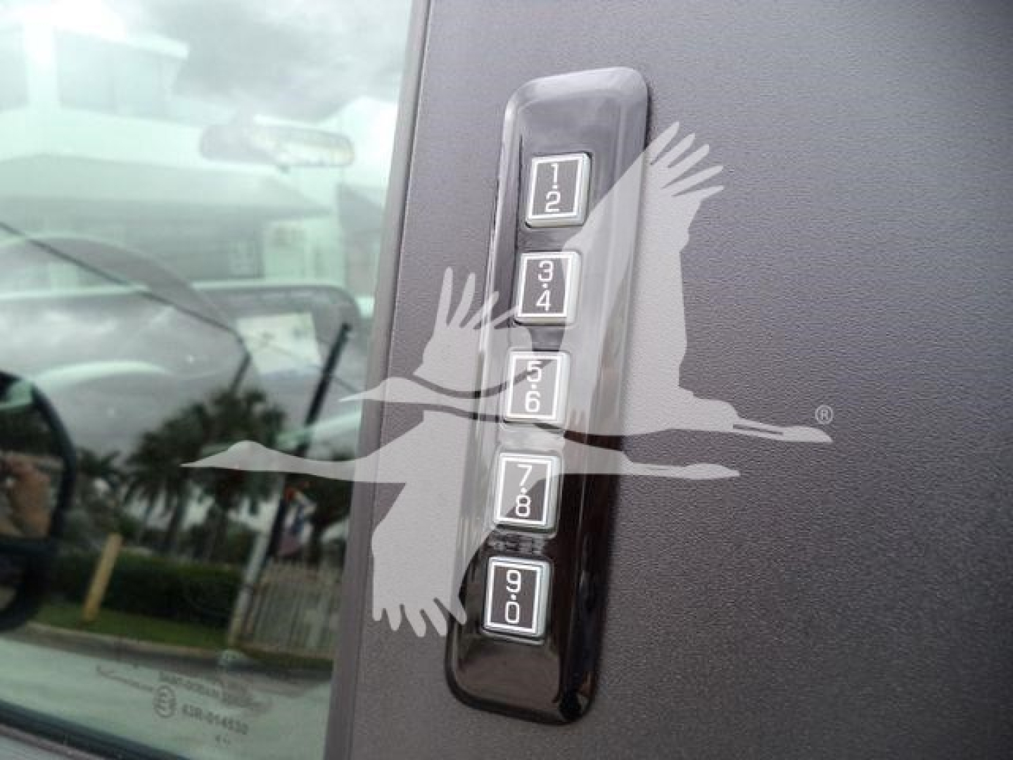 Ford F-450 dash-mounted keypad with numeric buttons 1-2, 3-4, 5-6, 7-8, 9-0 visible on a vehicle interior panel.