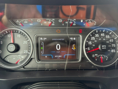 Dash cluster of 2022 International LT showing digital speedometer at 0 mph, gauges for RPM and speed, and warning icons visible.