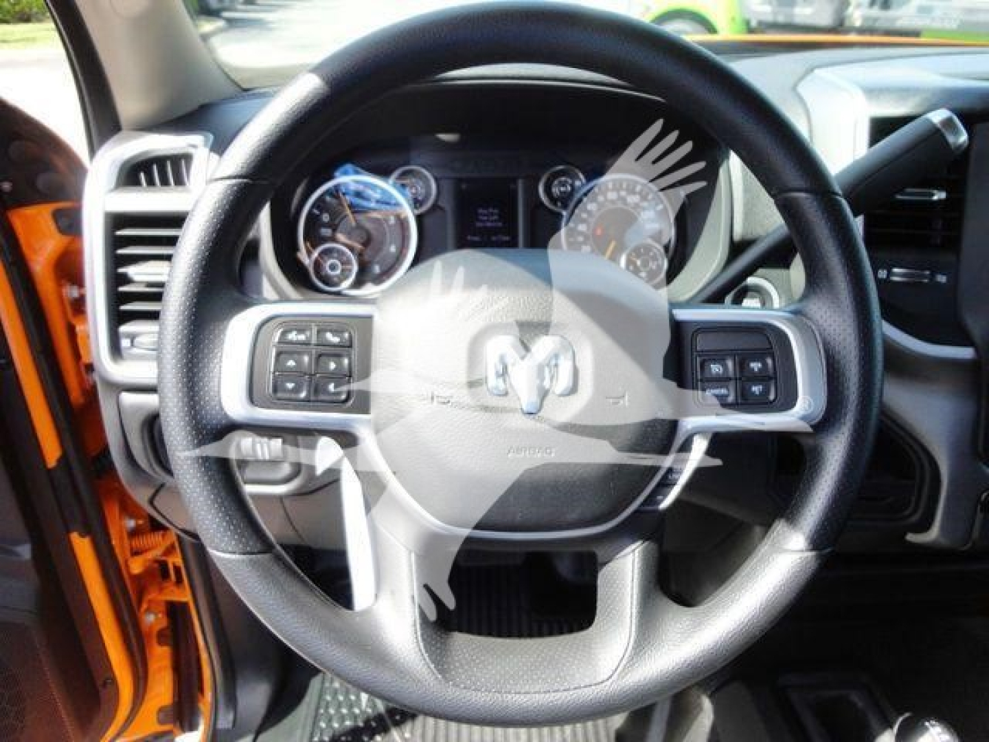 Ram 4500 dashboard and steering wheel view from driver side showing Ram emblem and instrument cluster.