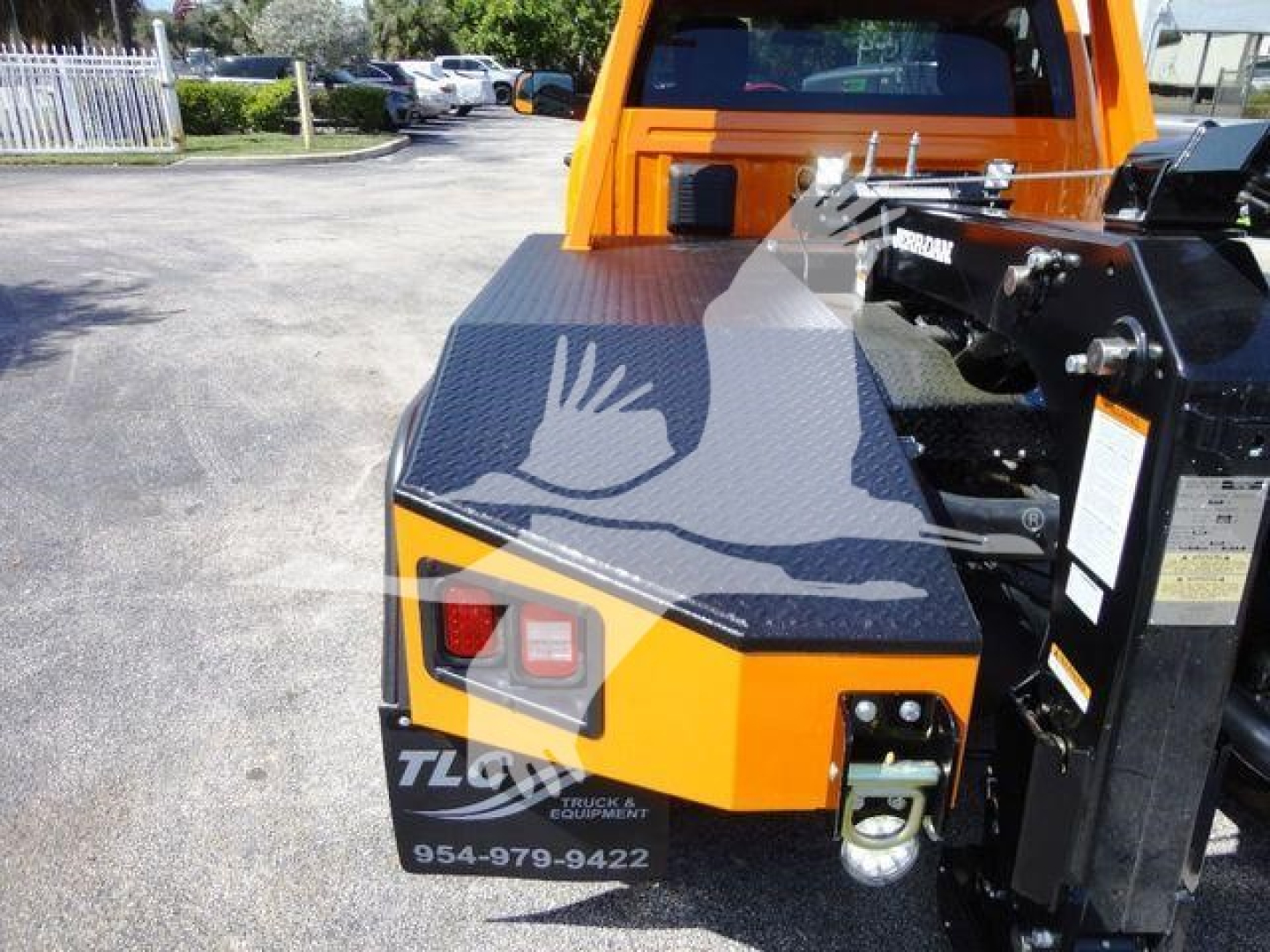 Ram 4500 SLT winch truck rear view showing winch mount and bumper with contact numbers and logo