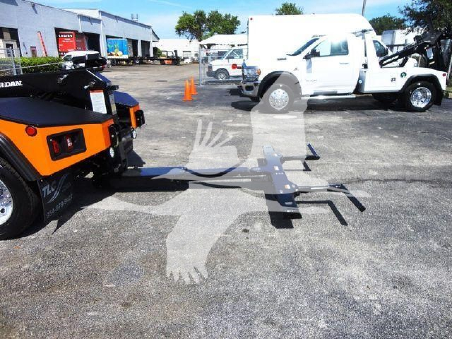 Ram 4500 SLT truck with tow hitch in tow yard showing winch equipment and trailer hitch setup.
