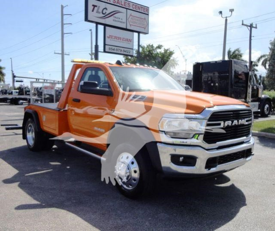 Orange Ram 4500 pickup truck with black grille and chrome bumper, showing stock number J70440 in a dealership lot.