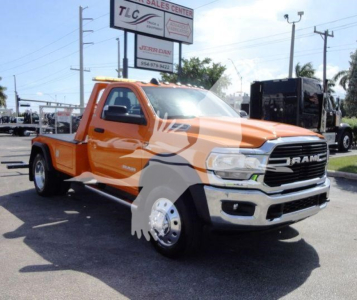 Orange Ram 4500 pickup truck with black grille and chrome bumper, showing stock number J70440 in a dealership lot.
