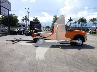 Ram 4500 SLT pickup with winch setup and trailer hitch in orange color, side profile view