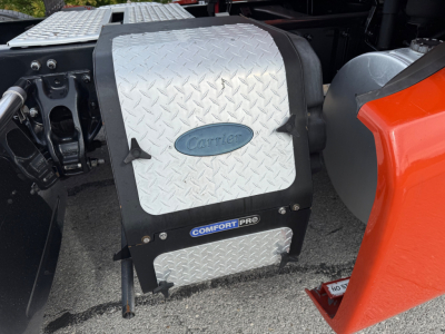 Kenworth truck 2021 T680 engine bay area with chrome diamond plate toolbox and Comfort Pro branding visible on side panel.